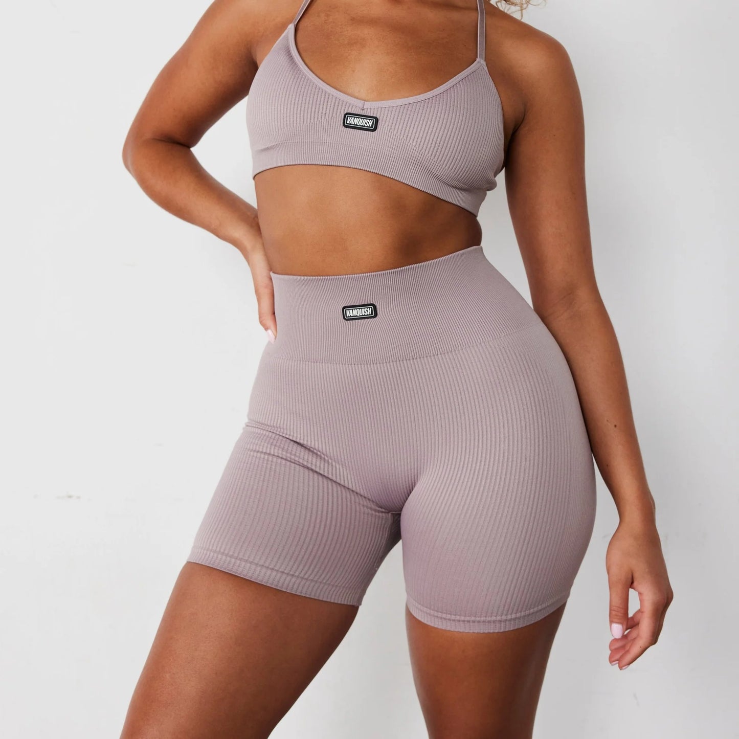 VANQUISH/ RIBBED SEAMLESS BLUSH CROSS BACK LOW SUPPORT WOMAN