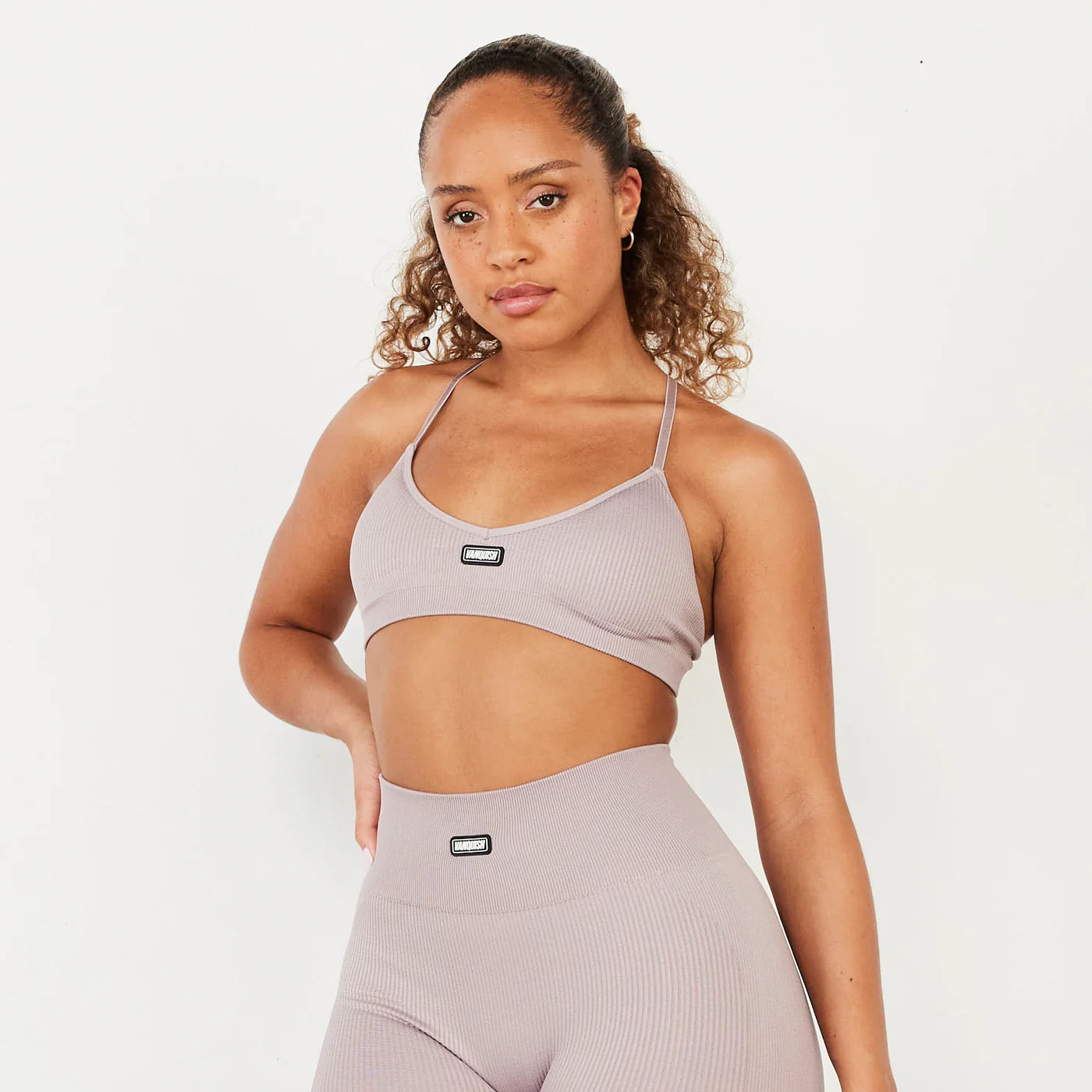 VANQUISH/ RIBBED SEAMLESS BLUSH CROSS BACK LOW SUPPORT WOMAN